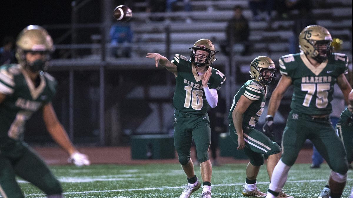 Timberline quarterback Hunter Campau tosses a screen pass during Friday night’s football game against Oak Harbor at South Sound Stadium in Lacey on Nov. 2, 2018.