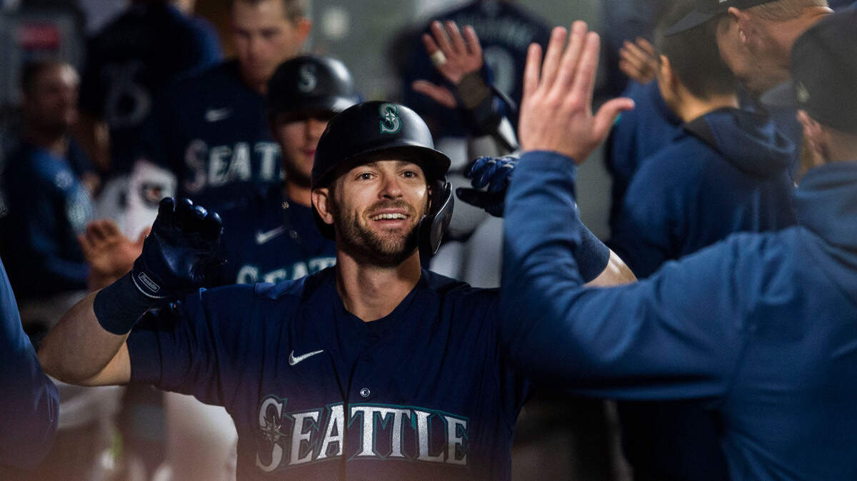 Mariners outfiielder Mitch Haniger high fives his teammates after hitting a two-run homer in the bottom of the fifth to give Seattle a 3-1 lead. The Mariners went on to win 6-4 to stay in the wild-card hunt Saturday night, Oct. 2, 2021 at T-Mobile Park in Seattle.