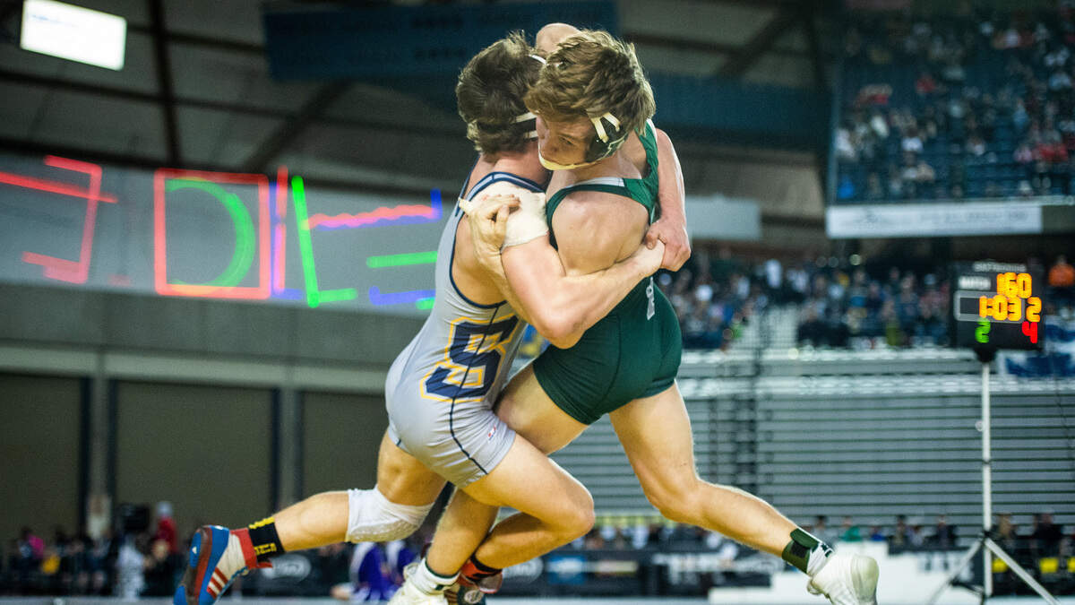 Southridge’s Mikael Failor grapples with Peninsula’s Isaac Casey during Mat Classic XXXI at the Tacoma Dome in Tacoma, Wash., on Saturday, Feb. 16, 2019.