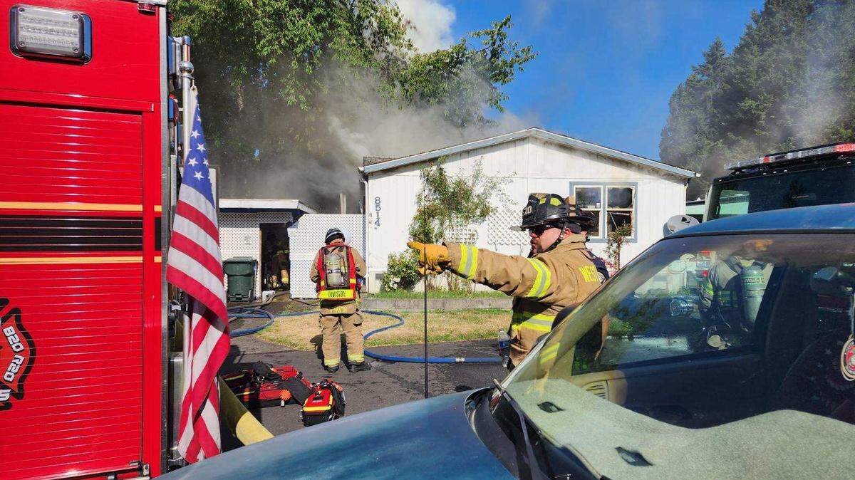 West Pierce Fire & Rescue firefighters on the scene of a house fire in Lakewood on Monday morning.