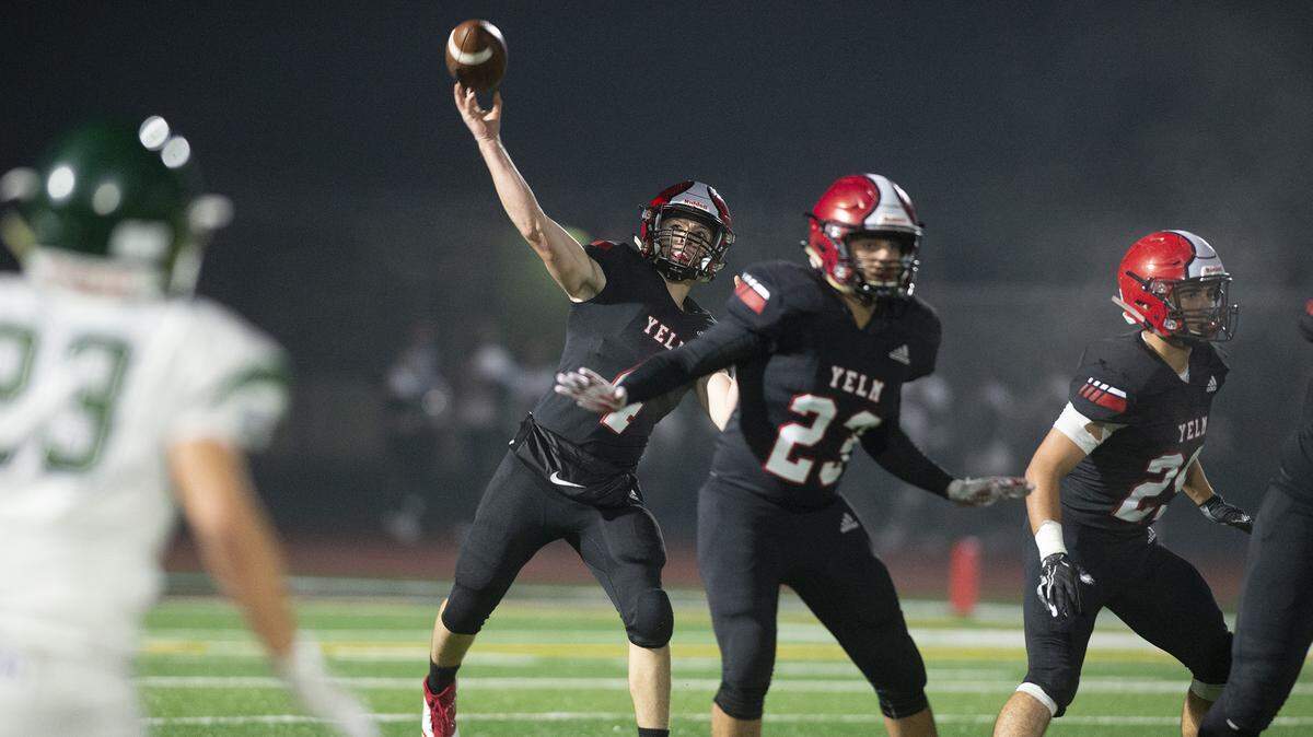 Yelm quarterback Benjamin Hoffmann fires a pass during Friday night’s Class 3A playoff football game against Edmonds-Woodway at Yelm High School on Nov. 8, 2019.