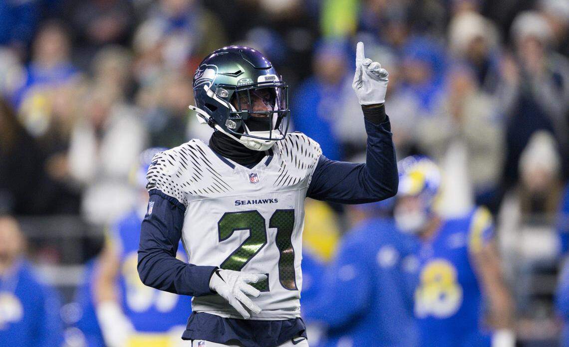 Seattle Seahawks cornerback Devon Witherspoon (21) reacts to a stop on defense during the first quarter of the game at Lumen Field, on Thursday, Dec. 18, 2025, in Seattle.