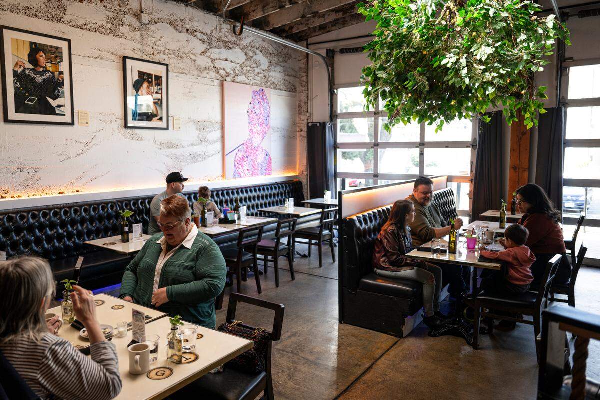 The dining room at Manuscript feels edgy at night but very breezy at brunch, and the roll-up garage doors lead to a lounge-like patio in amenable weather. Customers enjoy food and cocktails at Vinyl Brunch on Saturday, April 12.