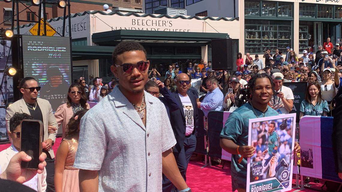 Mariners outfielder Julio Rodriguez greets and fist bumps with fans along Pike Place Market during a uniquely Seattle red carpet July 11, 2023, hours before he played for the American League in the 93rd MLB All-Star Game.