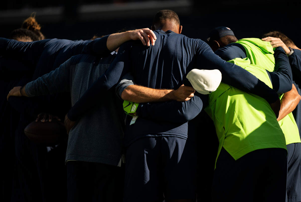 Seattle Seahawks quarterback Geno Smith (7) huddles with his teammates after warm ups, before the start of an NFL game against the Arizona Cardinals on Sunday, Oct. 16, 2022, at Lumen Field in Seattle.