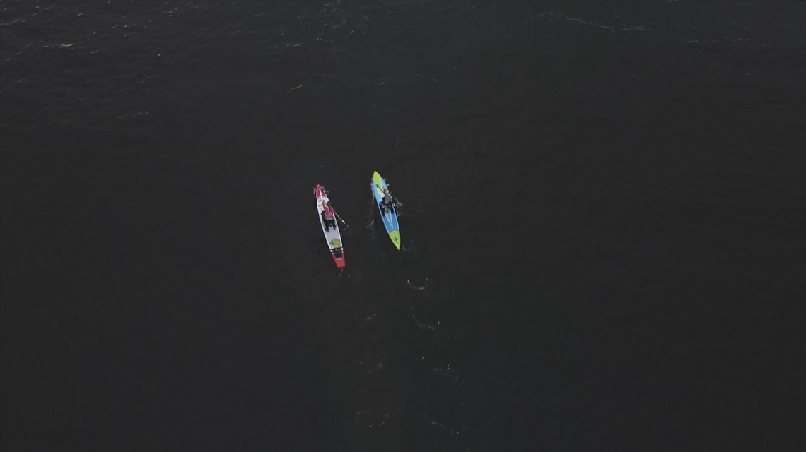 Jeannine Mackie and Erica Lichty paddling in the Seventy48 race.