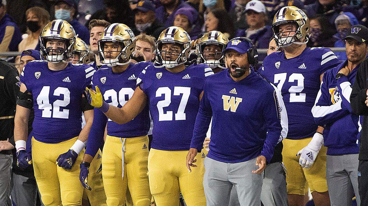 UW coach Jimmy Lake and the Huskies bench react after the Bruins picked up a first down to retain possession late in the fourth quarter. UCLA ran out the clock to defeat Washington, 24-17, on Saturday, Oct. 16, 2021 in Seattle.