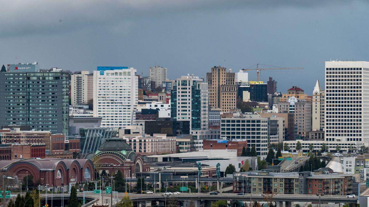 Rain clouds roll in from the southwest over downtown Tacoma, Wash., on Tuesday, April 12, 2022.