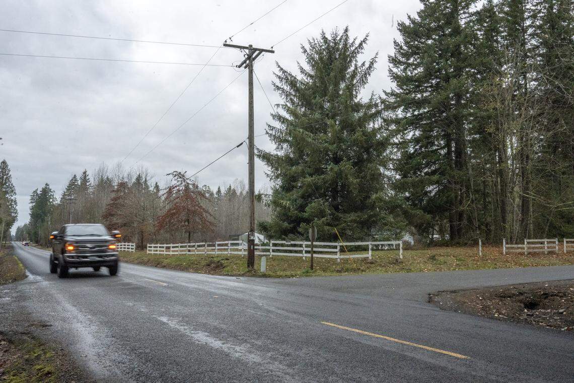 A car moves along 288th Street East at the intersection of 132nd Avenue East on Tuesday, Dec. 2, 2025, in Graham, Wash.
