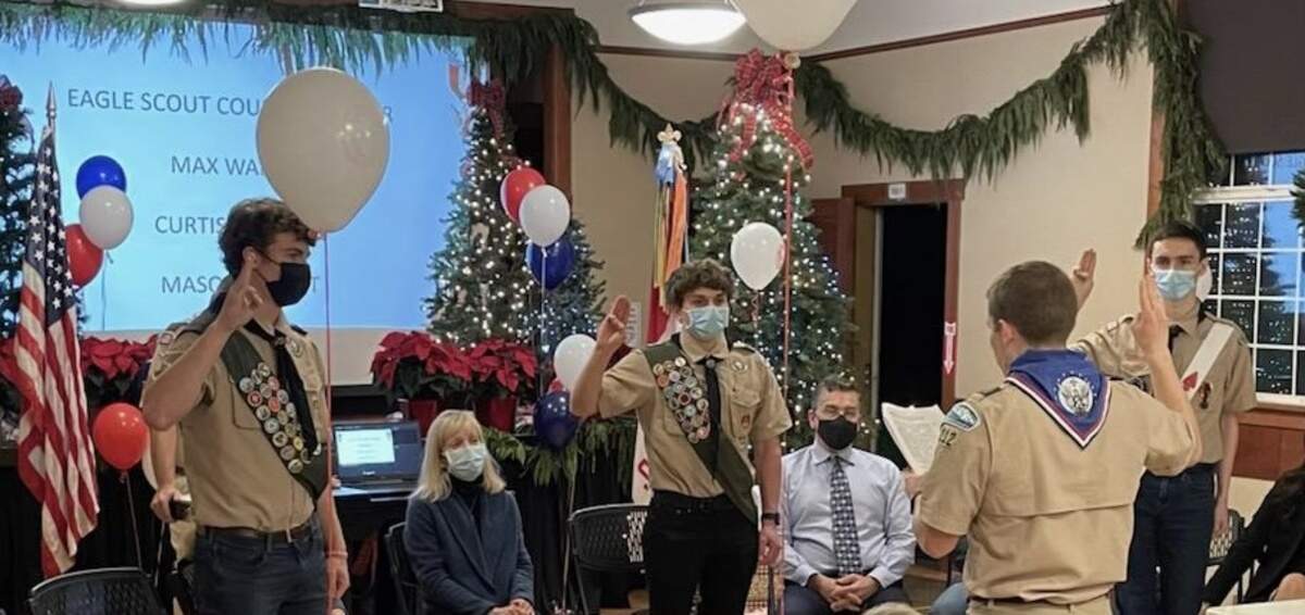 Max Walker, Curtis Carlson and Mason Elliott (left to right) take the Eagle Scout Oath.