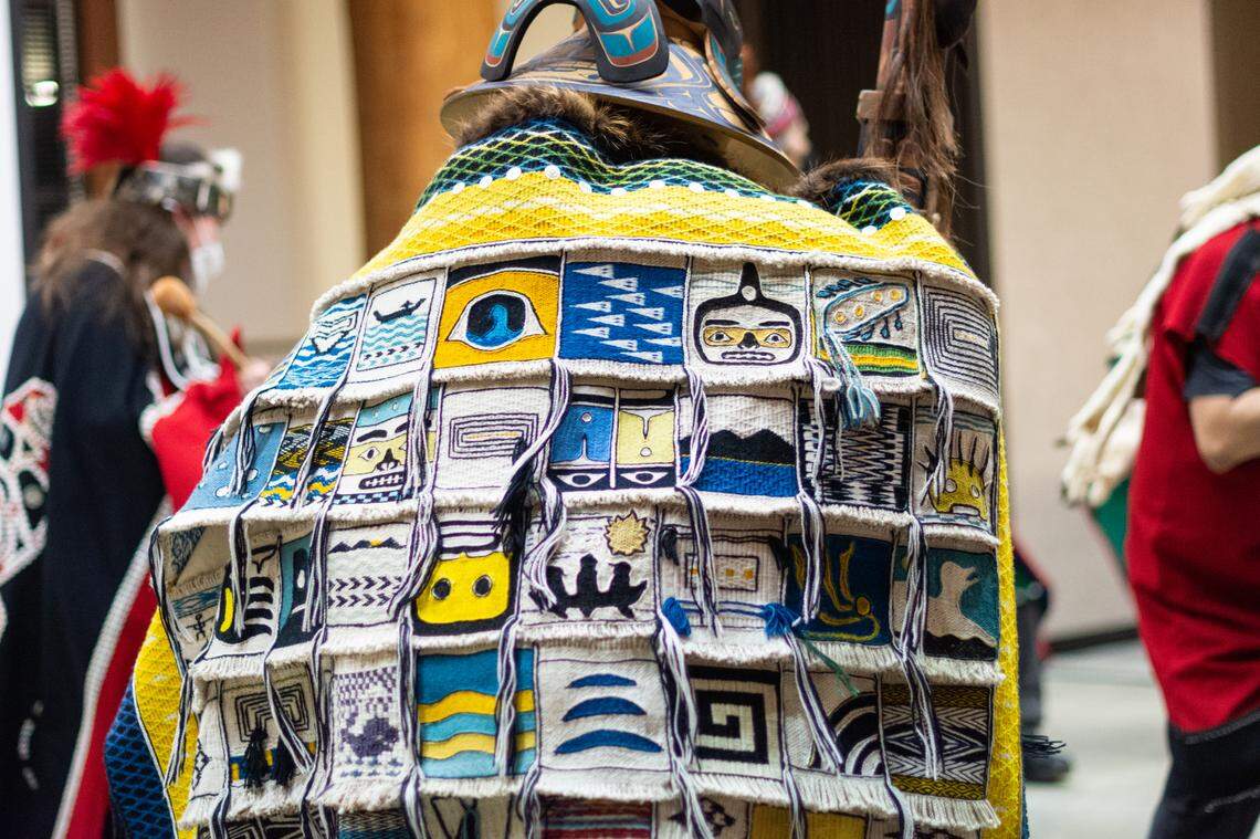 Florentino “Tiny” Barril wears the Evergreen Longhouse’s Chilkat robe as he leads the Alaska Kuteeyaa Dancers in a love song and dance at the Elizabeth Peratrovich Day celebration Wednesday, Feb. 16, at the Evergreen Longhouse at Evergreen State College in Olympia, Wash. Chilkat is a traditional form of weaving practiced by Indigenous Northwest coastal peoples. The Longhouse was gifted the robe created by late Chilkat weaver Clarissa Rizal and over 50 Chilkat weavers and reserves it for the use of the weavers and members of the tradition to dance in.