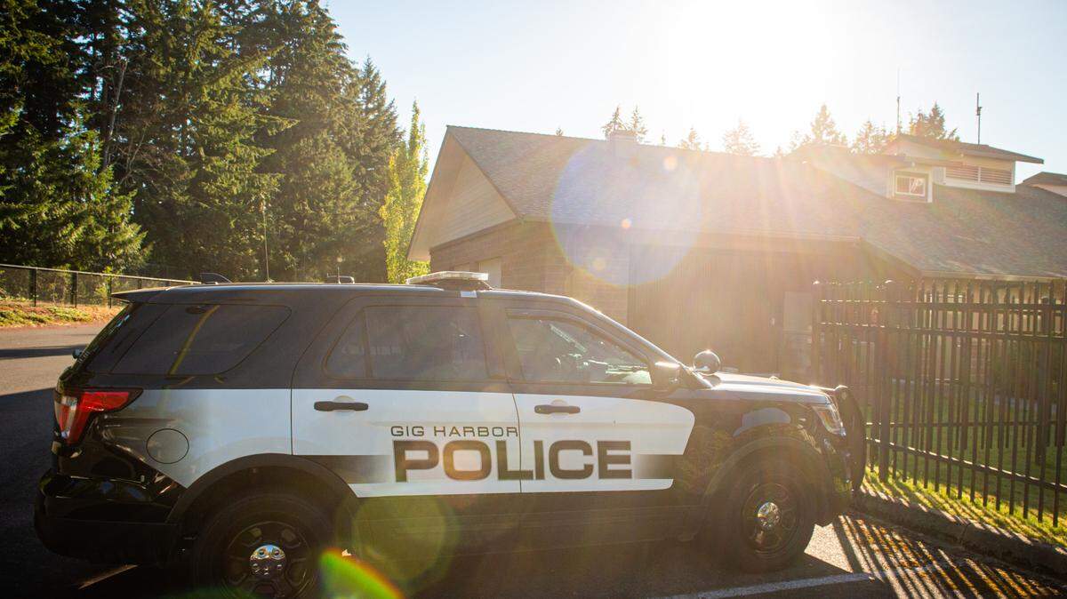 Gig Harbor police cars are seen parked behind the City Hall in Gig Harbor, Wash., on Monday, July 20, 2020.
