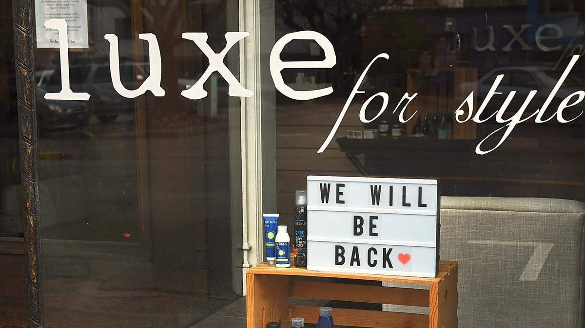 A downtown Olympia salon shares an encouraging message from their front window earlier this year.