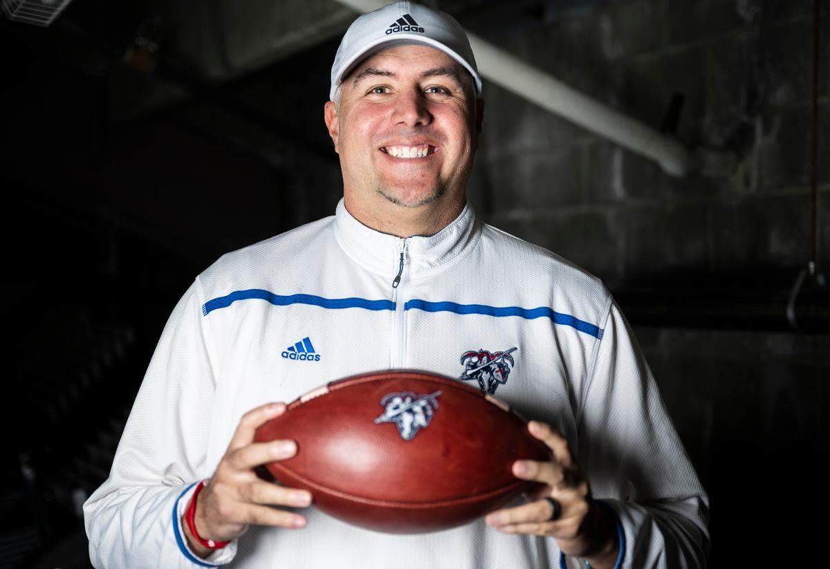Kennedy Catholic football head coach Sheldon Cross poses for a portrait after being selected as an offensive coach for The News Tribune’s 2022 All-Area football team, at Mount Tahoma High School in Tacoma, Wash. on Dec. 4, 2022.