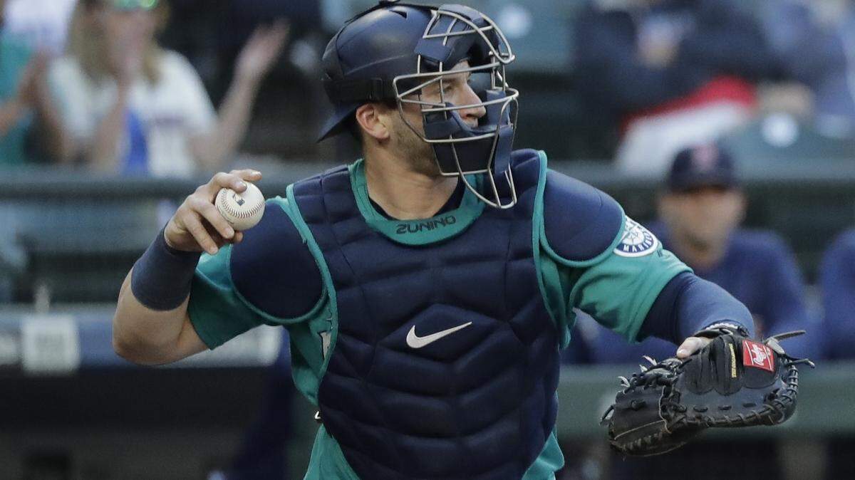 Seattle Mariners catcher Mike Zunino makes a throw during a baseball game against the Boston Red Sox, Friday, June 15, 2018, in Seattle. (AP Photo/Ted S. Warren)