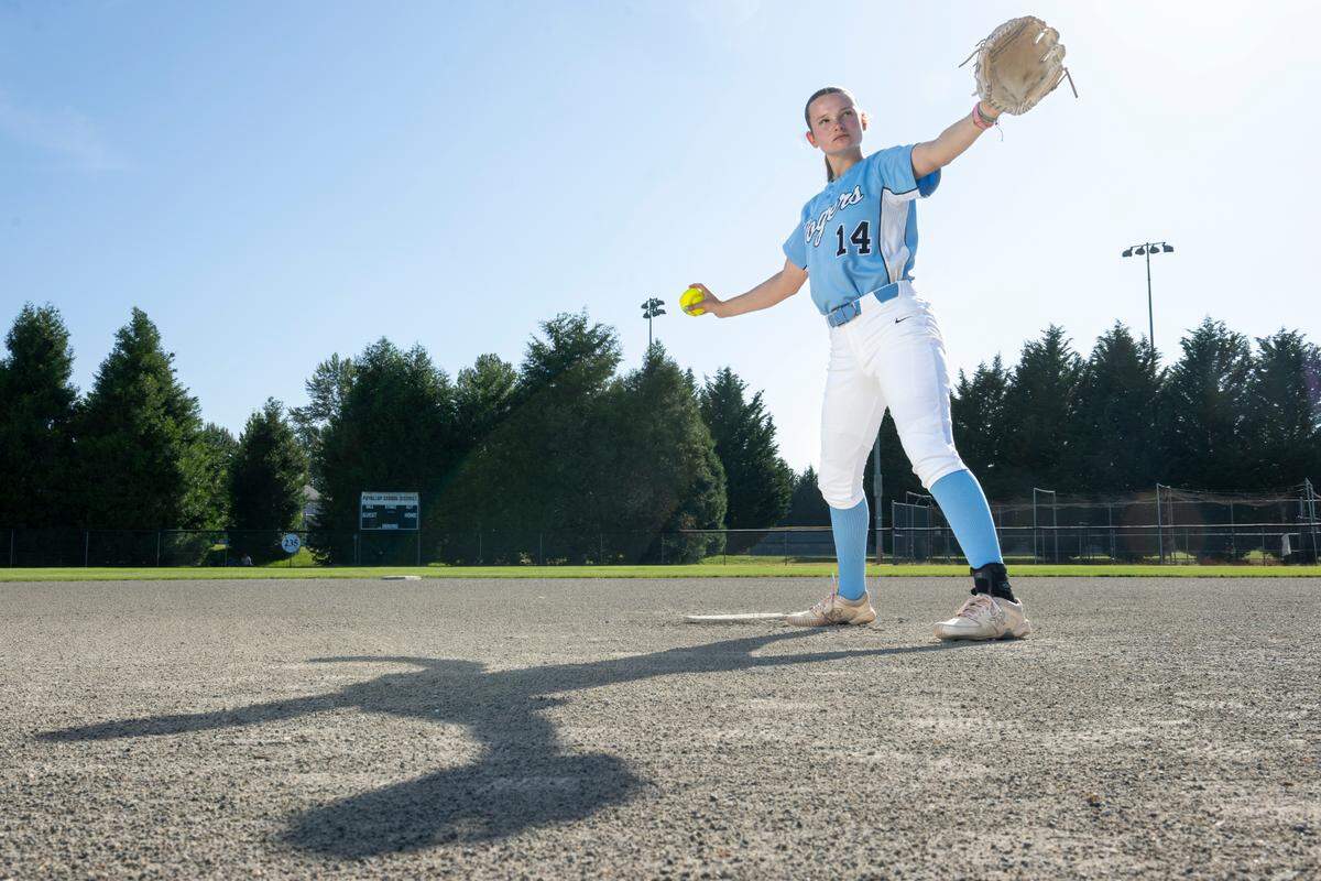 The News Tribune’s 2025 All-Area softball player of the year, Rogers High School freshman pitcher Sierra Murray, stands ready for a pitch on Tuesday, June 10, 2025, at the team’s home field in Puyallup, Wash.