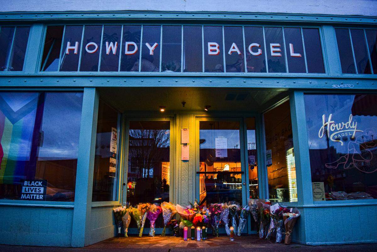 A memorial in honor of Howdy Bagel co-founder Jake Carter grew at the restaurant entrance, 5421 South Tacoma Way in Tacoma, Wash., on Sunday, Jan. 7, 2024. Carter was killed in New Orleans on Jan. 5.