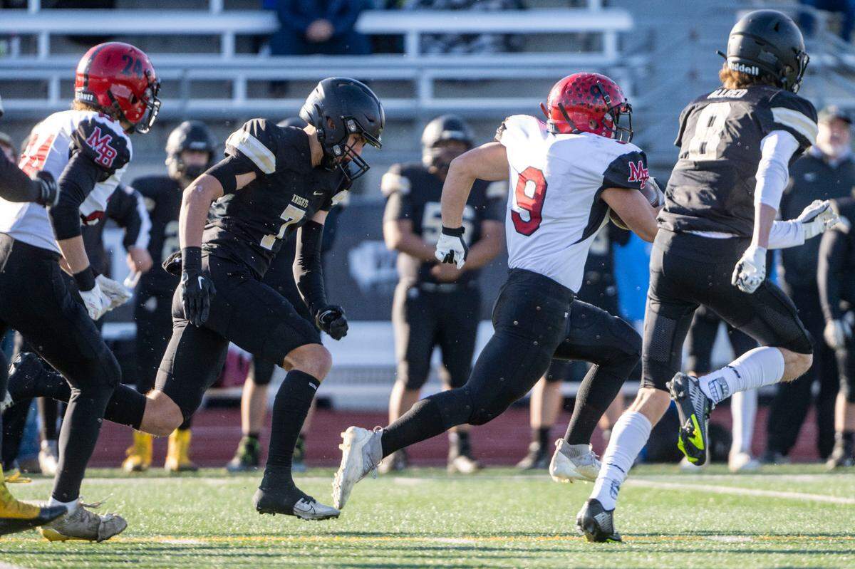 Mount Baker’s Marcques George runs past Royal’s Edgar Delarosa (7) during the first quarter of the Class 1A state championship game on Saturday, Dec. 3, 2022, at Harry E. Lang Stadium in Lakewood, Wash.