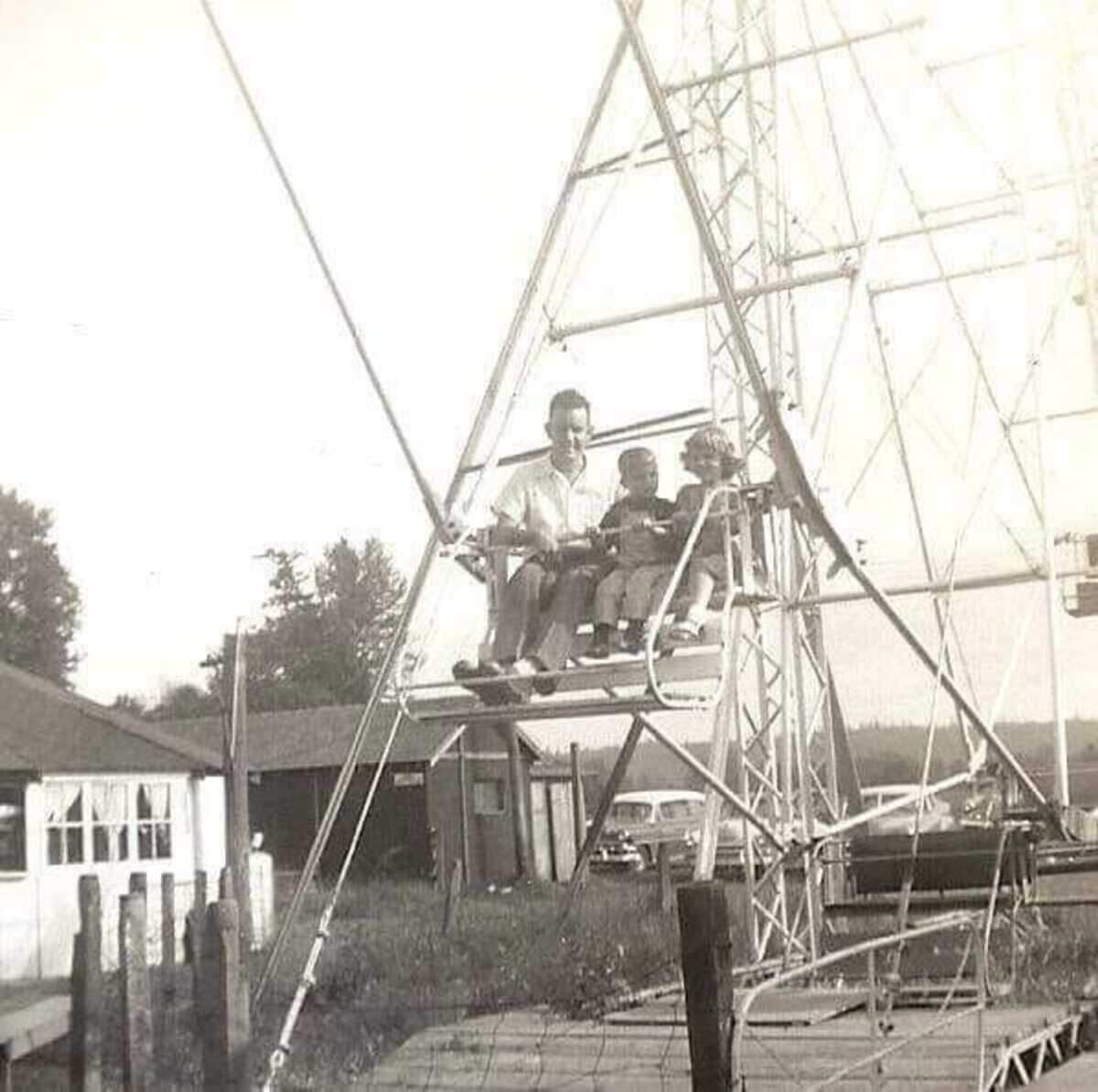 Ralph Yoder, left, Don Yoder, middle, and Janis Yoder Breen, right, sit on the Ferris wheel at Pony Lake Park in the Puyallup area.