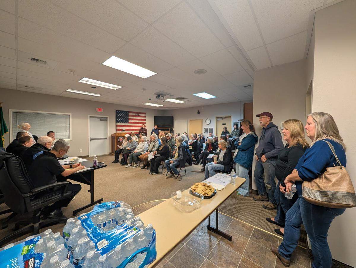 Residents gather inside the Key Peninsula Fire Department headquarters, Station 46, for a town hall about the department’s proposed 2026 budget and an update on their Key Center property Saturday, Nov. 15, 2025, in Key Center, Wash.