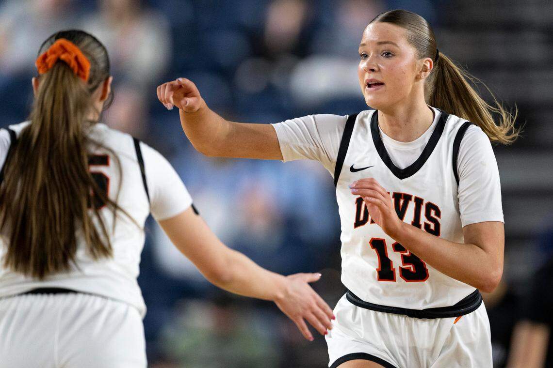 Davis guard Cheyenne Hull (13) jogs back on defense along with teammate guard Nevaeh “Deets” Parrish (15) during the first quarter of the Class 4A state championship game at the Tacoma Dome on Saturday, March 8, 2025, in Tacoma, Wash.