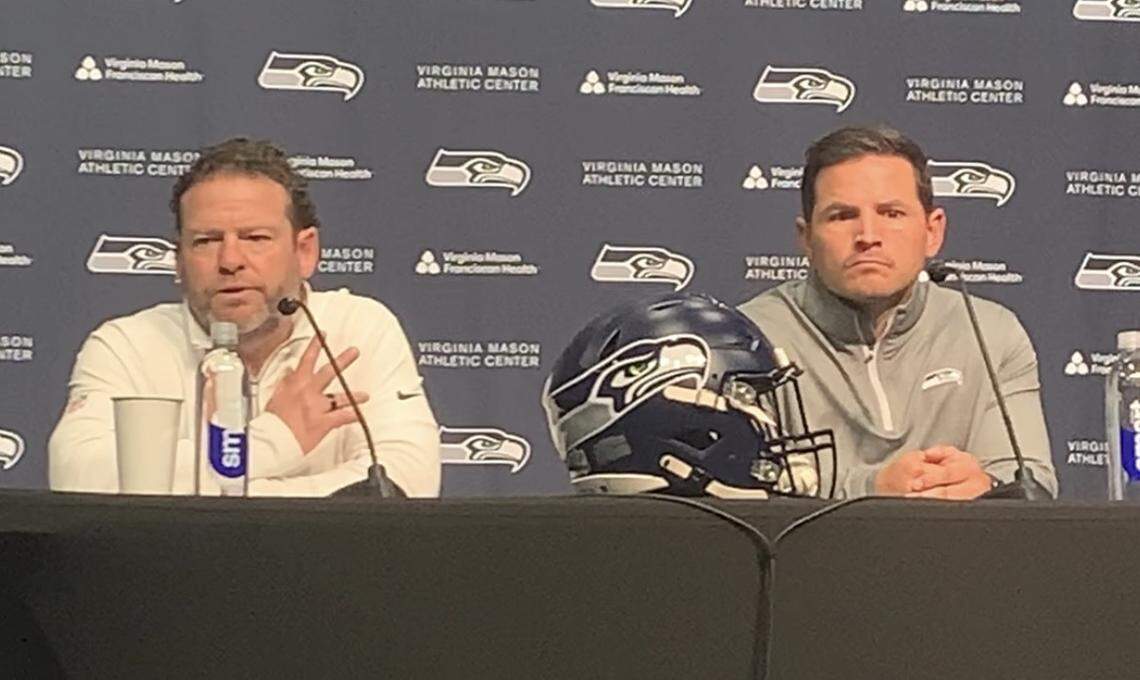 Seattle Seahawks general manager John Schneider (left) and coach Mike Macdonald speak at the team’s Virginia Mason Athletic Center in Renton Monday, April 20, 2026, three days before the NFL draft begins.