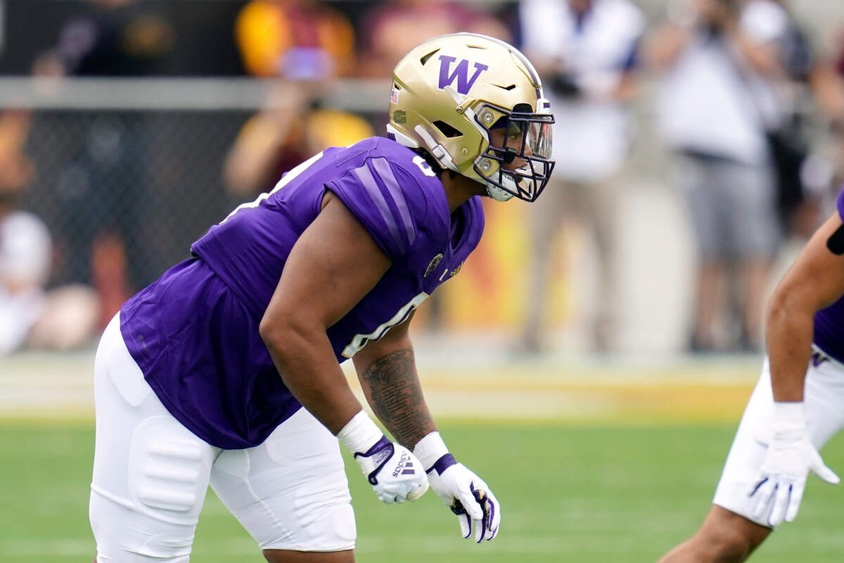 Washington defensive lineman Sav’ell Smalls moves with the snap of the ball during the first half of an NCAA college football game against Arizona State in Tempe, Ariz., Saturday, Oct. 8, 2022. (AP Photo/Ross D. Franklin)