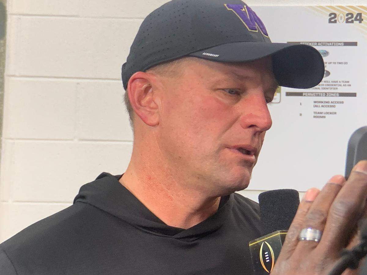 Coach Kalen DeBoer with tears in his eyes speaking just outside Washington’s locker room at NRG Stadium moments after the Huskies lost the national championship game to Michigan in Houston, Jan. 8, 2024.