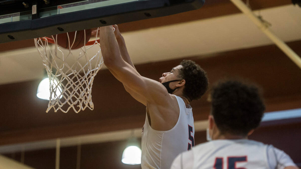 Wilson High School forward Jackson Dorsey throws down a dunk as teammate Tre Walker looks on in a Class 3A Pierce County League game against Lincoln on Friday, May 21, 2021 in Tacoma, Wash.