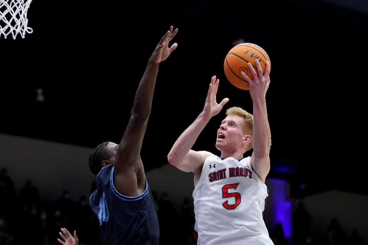 Saint Mary’s guard Jabe Mullins (5) shoots against San Diego guard Marcellus Earlington (10) during the second half of an NCAA college basketball game in Moraga, Calif., Thursday, Feb. 10, 2022. (AP Photo/Jed Jacobsohn)