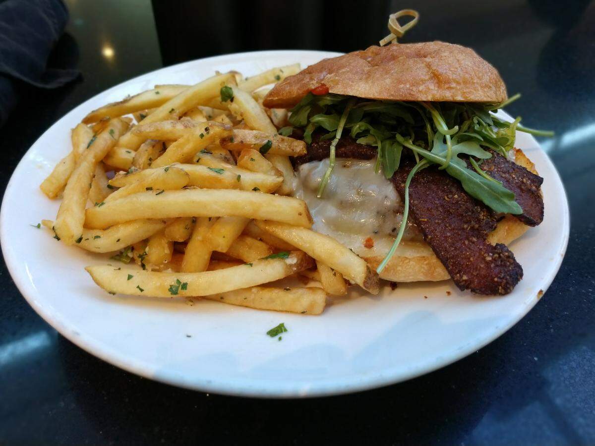 The house burger with pastrami bacon and garlic fries at Bar 960 at Hotel Murano in downtown Tacoma.