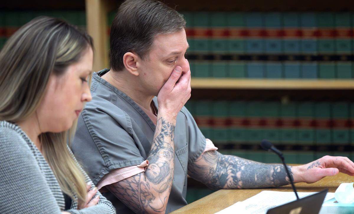 Jason Lee Allison, 49, wipes away tears as he apologizes to his victim’s family during allocution at his resentencing hearing in Pierce County Superior Court on Tuesday, Dec. 3, 2024, for his first-degree-murder conviction in the killing-for-hire of Marietta Dela Cruz in 1994, when Allison was 18 years old.