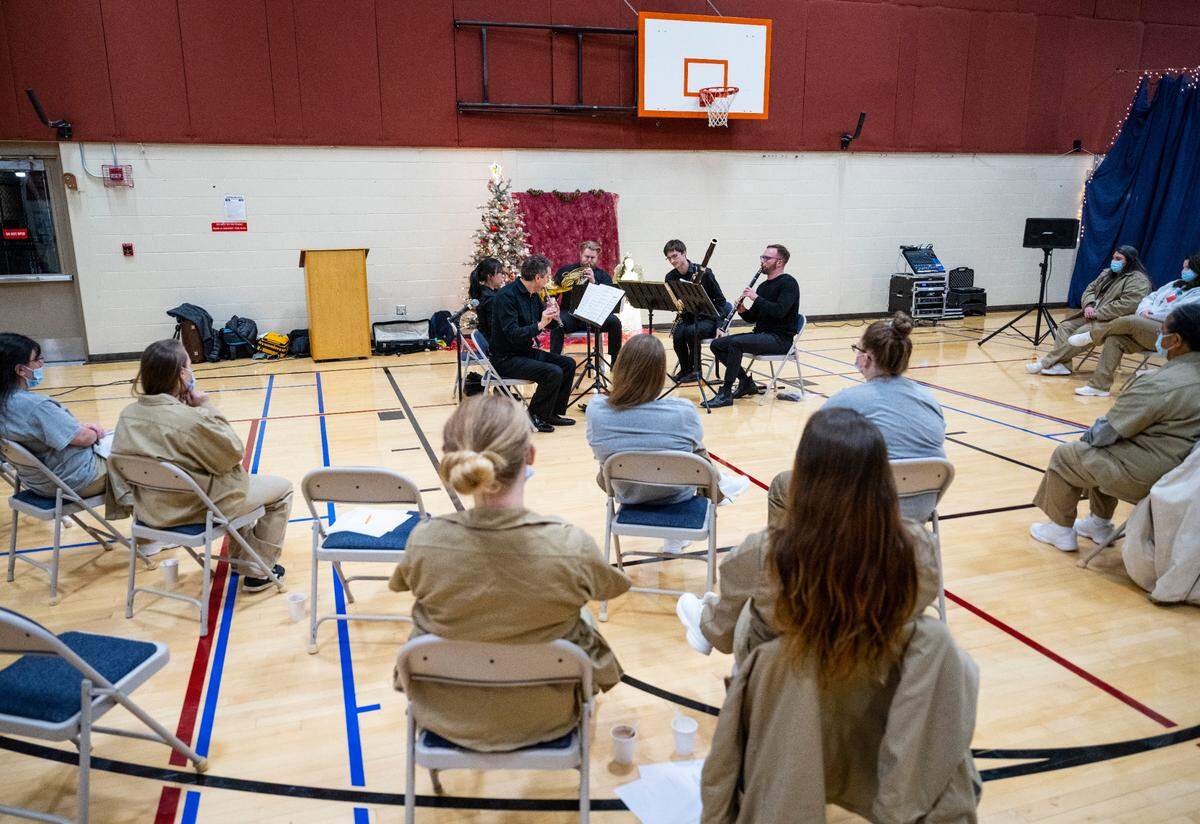 Seattle Symphony members perform live for inmates at the Washington Corrections Center for Women in the center’s gymnasium near Gig Harbor, Wash. on Dec. 6, 2022.