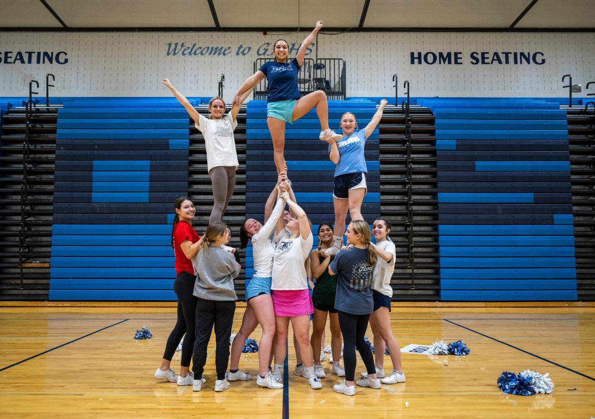 The Gig Harbor High School cheer team performs a stunt Feb. 28, 2023 in the school's gymnasium that was a part of their record-breaking routine. They competed in the 3A Game Day Small division competition at the Washington Interscholastic Activities Association (WIAA) Cheerleading Tournament Central Feb. 4, 2023.