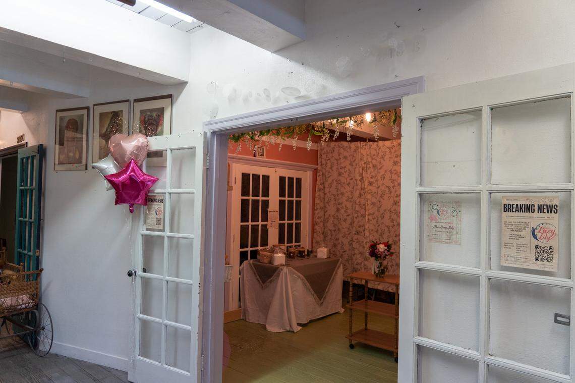 The Lazy Lily is located on the middle floor of Sanford & Sons Antiques, accessed by a staircase inside the store. 