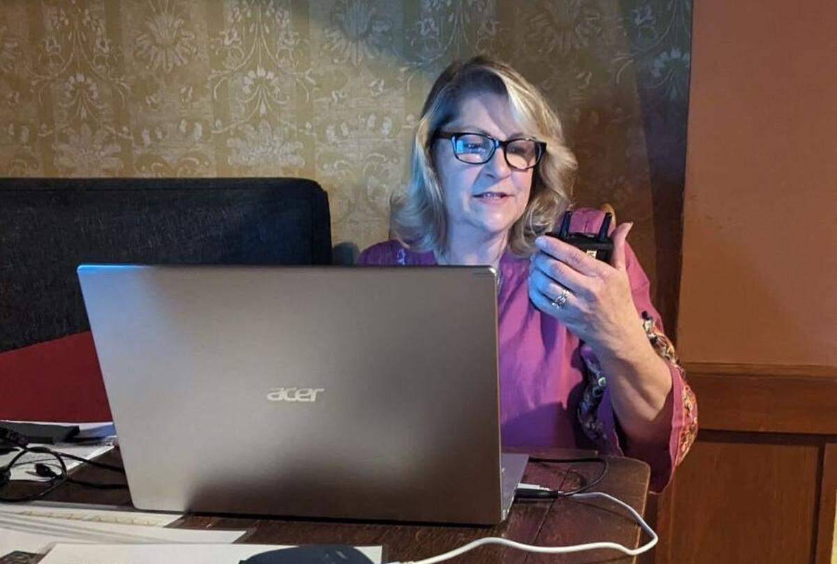 Lead paranormal researcher with Red Ball Paranormal Investigations Stephanie Brock-Farrington holds a device called an Ovilis on July 1, 2023, inside the ballroom of Manresa Castle in Port Townsend. An Ovilis is a device paranormal researchers use to communicate with the dead.
