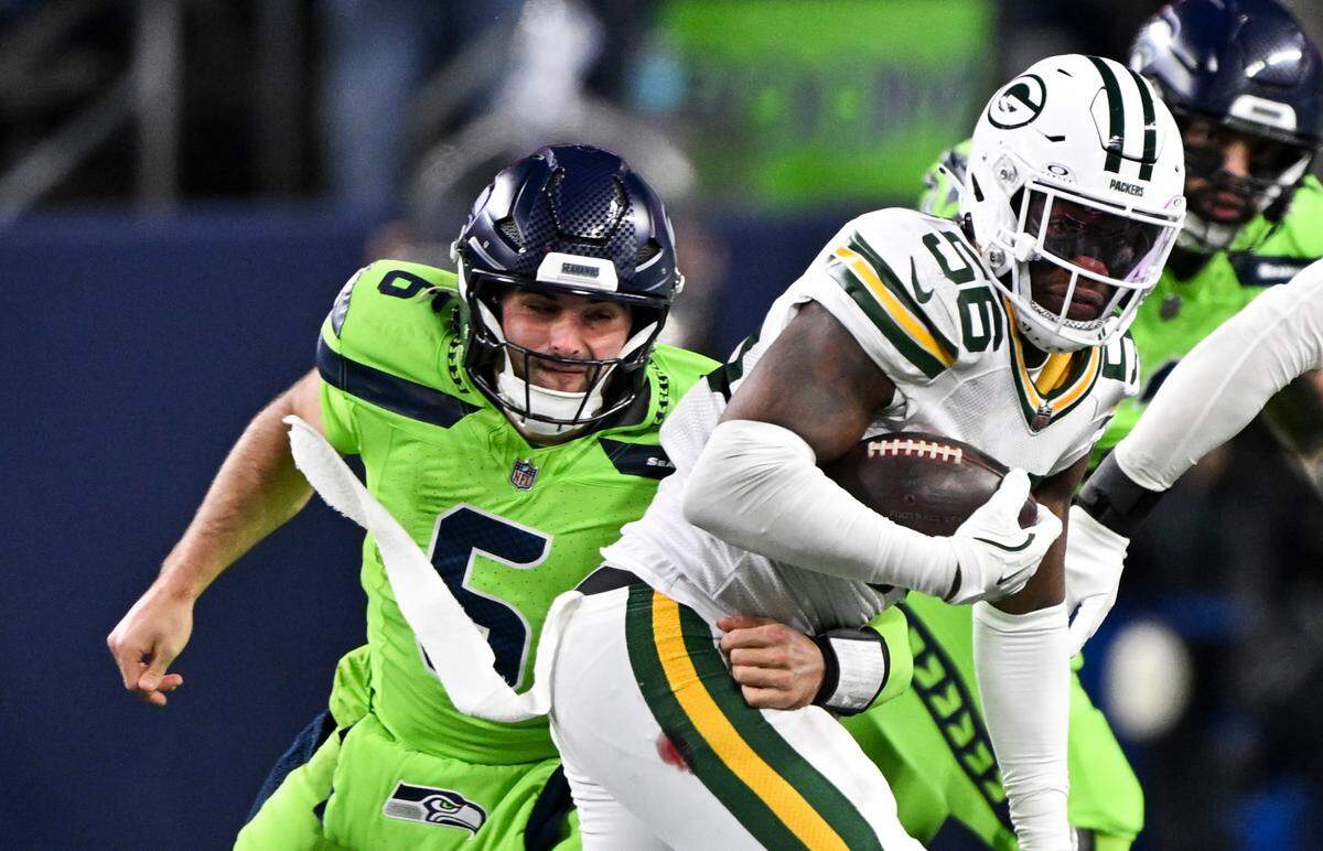 Seattle Seahawks quarterback Sam Howell (6) attempts to tackle =g56 after throwing an interception during the fourth quarter of the game at Lumen Field, on Sunday, Dec. 15, 2024, in Seattle, Wash.