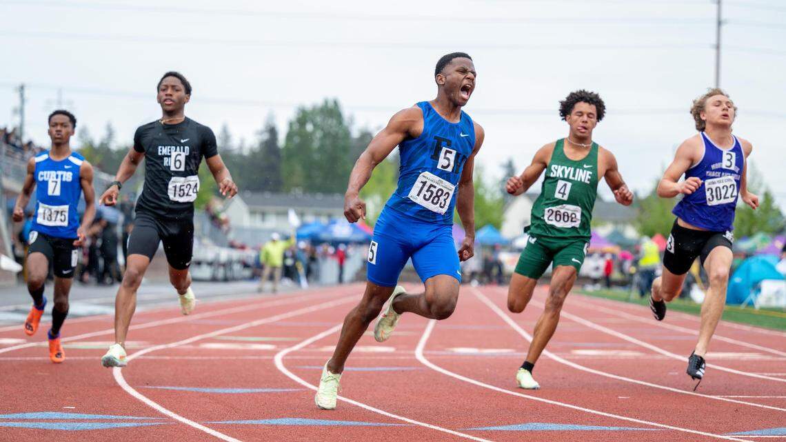 Federal Way’s Isaiah Davis wins the state championship title for the Boys 4A 100 Meter Dash at the WIAA State Track & Field Championship at Mount Tahoma High School on Friday May 27, 2022.