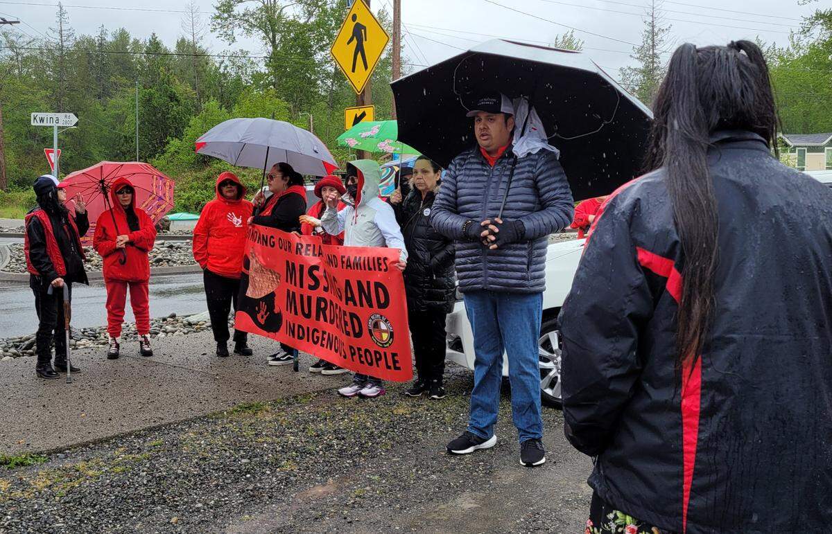 Lummi Indian Business Council Vice Chair Terrance Adams, right, thanks the Tribal members and community members who gathered in honor of Missing and Murdered Indigenous Women and People Awareness Day Thursday, May 5, on the Lummi Nation Reservation near Bellingham. The memorial walk, organized by the Tribe’s advocacy and support services group Lummi Victims of Crime, highlighted the high rate of disappearances and murders Indigenous people face.