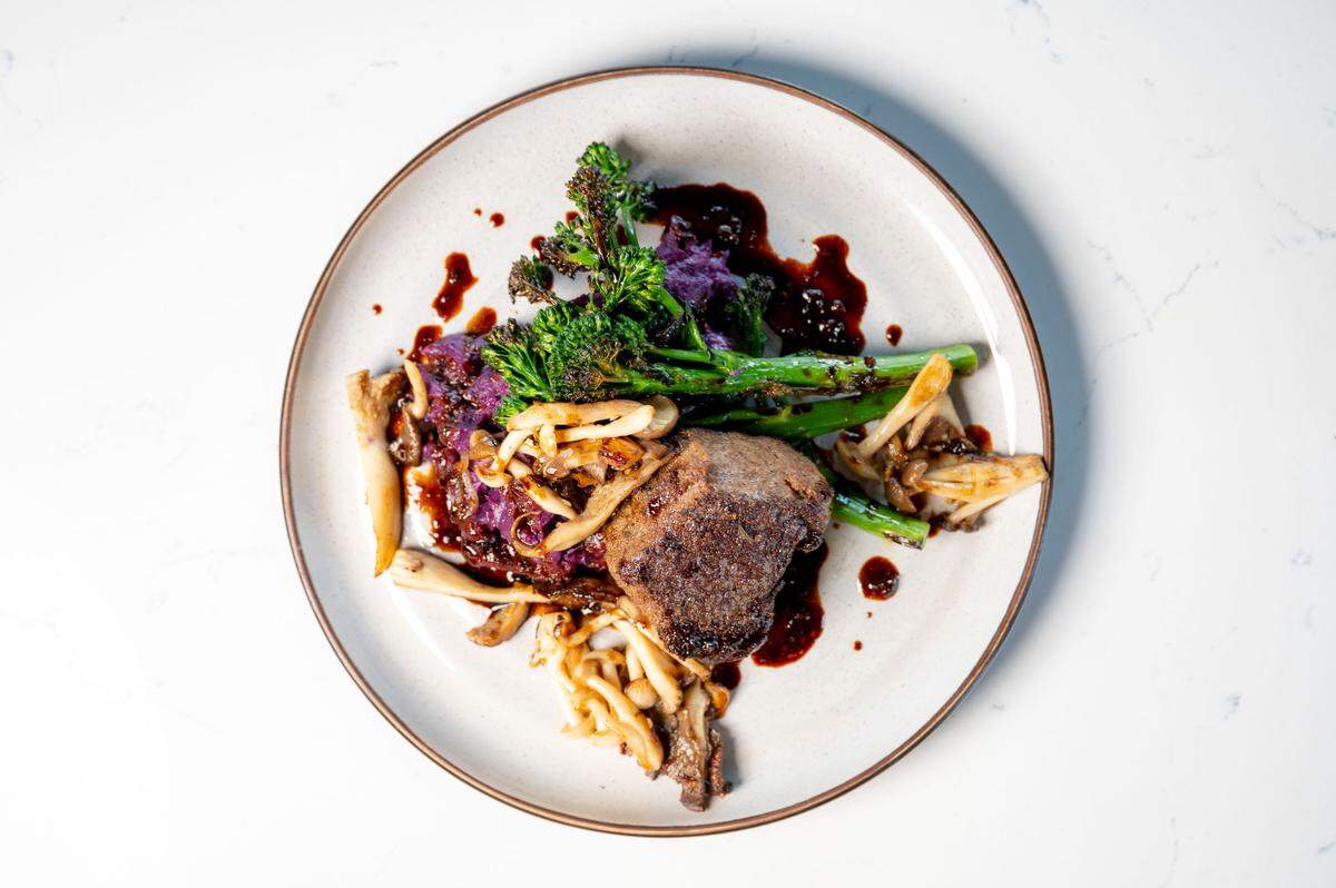 ALMA Lounge is a restaurant and cocktail bar in Tacoma, Wash., serving contemporary indigenous foods made with local ingredients. A bison steak with a duck bordelaise joins Adam’s Mushrooms, charred broccolini and purple sweet potatoes, pictured here on March 9, 2022.