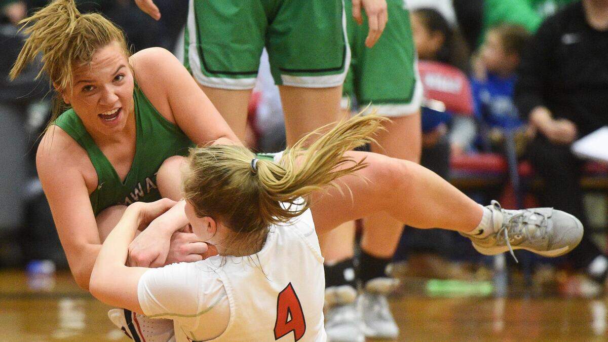 Tumwater’s Cassie Kaufman and Black Hills Megan River fight for a loose ball during the second quarter. Black Hills played Tumwater in a basketball game at Black Hills High School in Olympia, Wash., on Friday, Jan. 24, 2020.