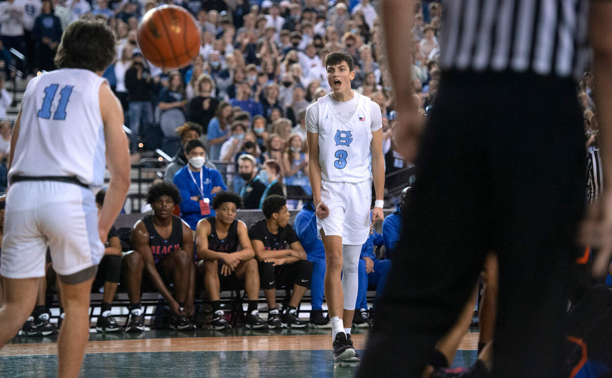 Gig Harbor’s Will Landram lets out a yell to teammate Christian Parrish after drawing a foul against the Rainier Beach Vikings during Thursday afternoon’s quarterfinal game of the WIAA 3A Boys Basketball State Championships tournament in the Tacoma Dome in Tacoma, Washington, on Thursday, March 3, 2022. Rainier Beach won the game, 65-60.