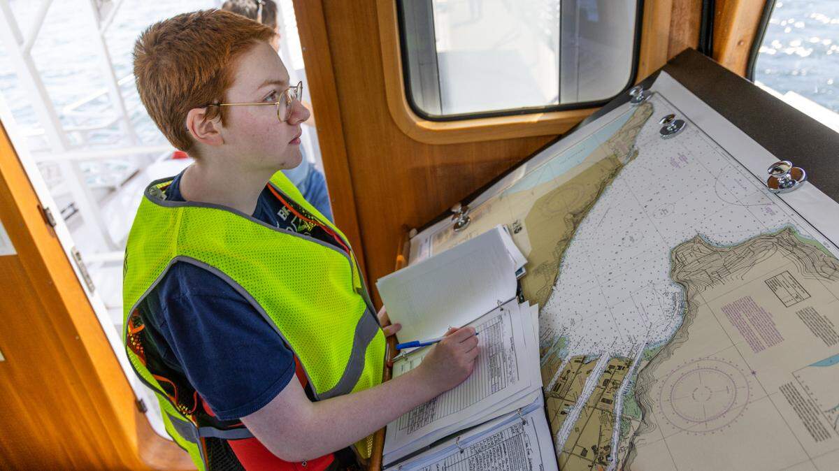 Tacoma Public Schools Science and Math Institute marine biology students conduct a class on Commencement Bay onboard the Doolin Rogers.