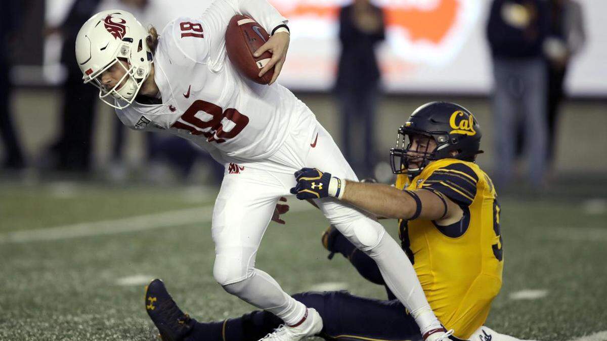 Washington State quarterback Anthony Gordon, left, is sacked by California’s Ben Schrider in the first half Saturday, Nov. 9, 2019, in Berkeley, California.
