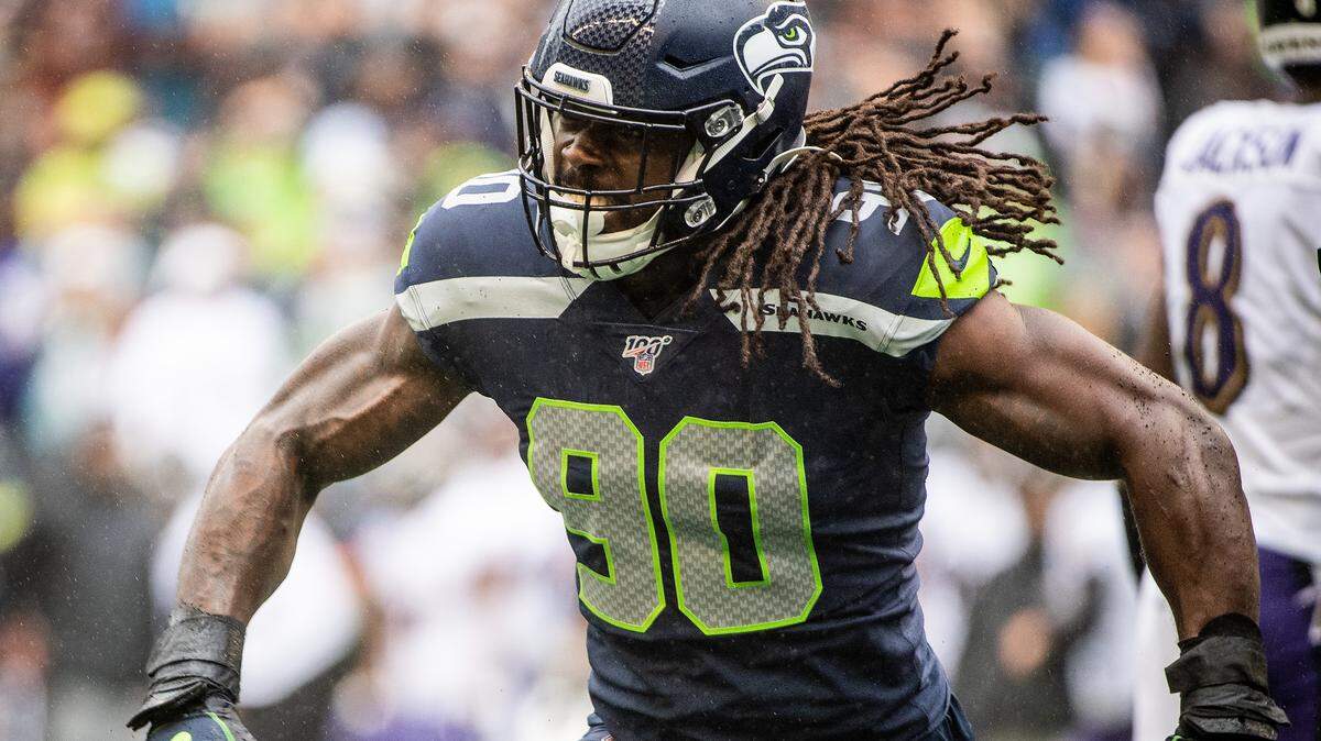 Seattle Seahawks outside linebacker Jadeveon Clowney (90) celebrates a tackle during a October game against the Baltimore Ravens. He’s been ruled out for Sunday’s game at Carolina.