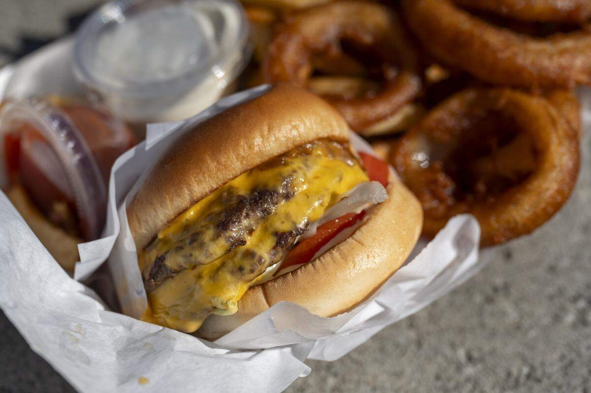 A double cheeseburger from Out and About Burgers is pictured on Tuesday, Oct. 7, 2025, in Puyallup.