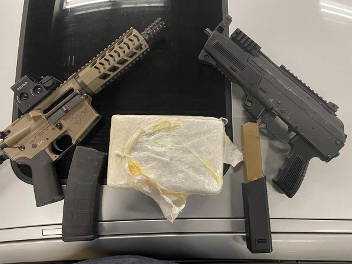 Guns seized by federal agents as part of an investigation into a narcotics-trafficking ring accused of smuggling controlled substances into Washington.