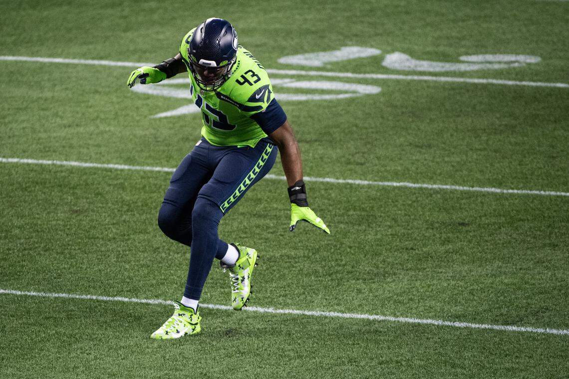 Seattle Seahawks Carlos Dunlap dances after sacking Arizona Cardinals quarterback Kyler Murray. The Seattle Seahawks played the Arizona Cardinals in a NFL football game at Lumen Field in Seattle, Wash., on Thursday, Nov. 19, 2020.