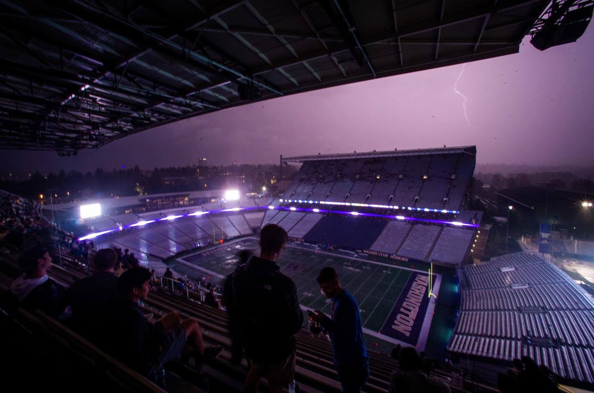 Lightning strikes as the game is delayed due to severe weather in the first quarter. The Washington Huskies played the California Golden Bears in a NCAA football game at Husky Stadium in Seattle, Wash., on Saturday, Sept. 7, 2019.
