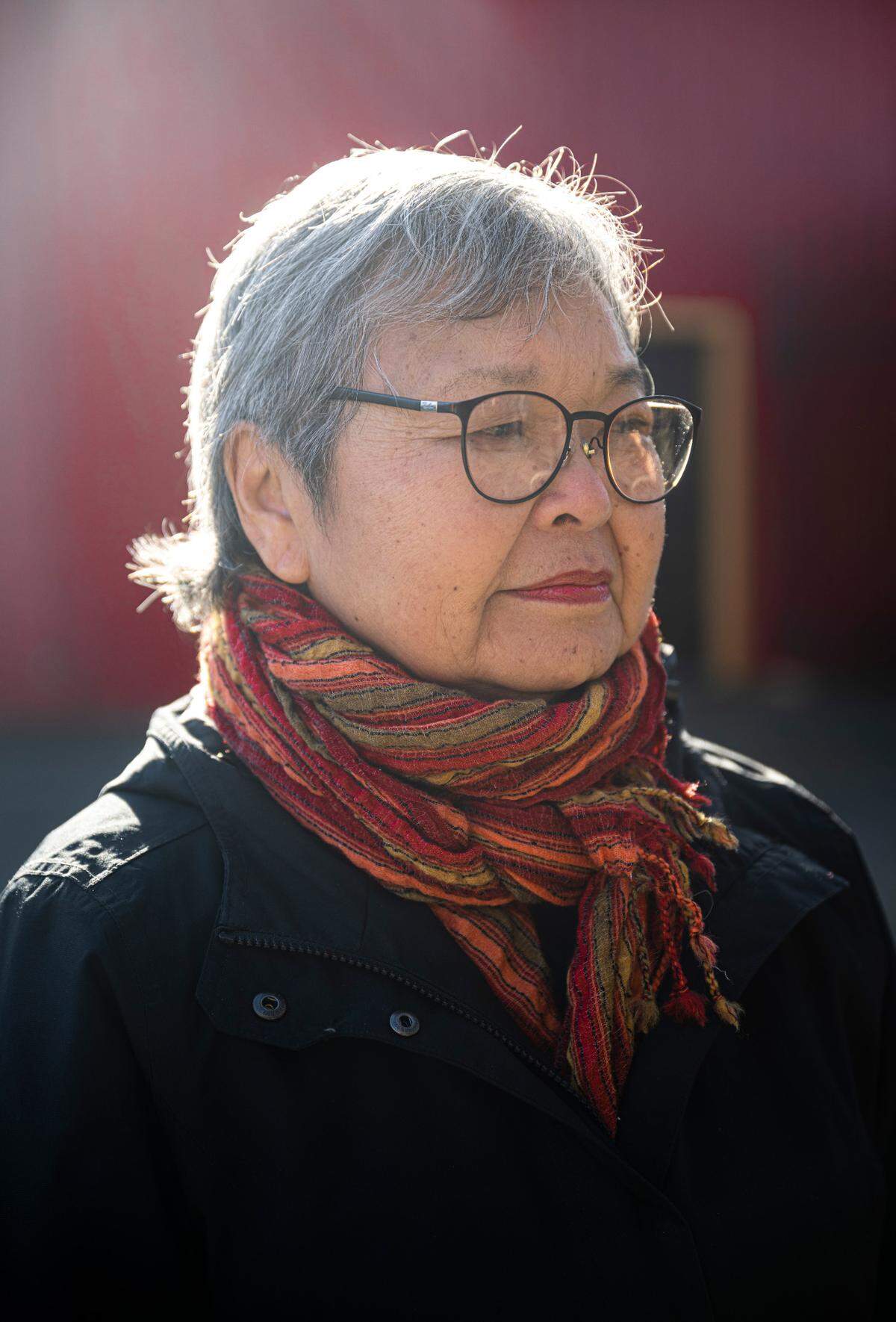 Mary Tanaka Abo, 82, poses for a portrait next to the statue, “Harmony,” that was created by Japanese American artist George Tsutakawa, to honor the people of Japanese ancestry that were incarcerated on the Washington State Fair grounds in Puyallup, Wash. during WWII, on Feb. 1, 2023. Abo was two-years-old when she and her family were forced to live at the camp after being removed from their home in Juneau, Alaska in 1942. The Puyallup Valley Japanese American Citizens League plans to build a remembrance gallery under the grandstands of the Washington State Fair to honor all of the Japanese American people who were incarcerated at the “Puyallup Assembly Center” or “Camp Harmony” during WWII.